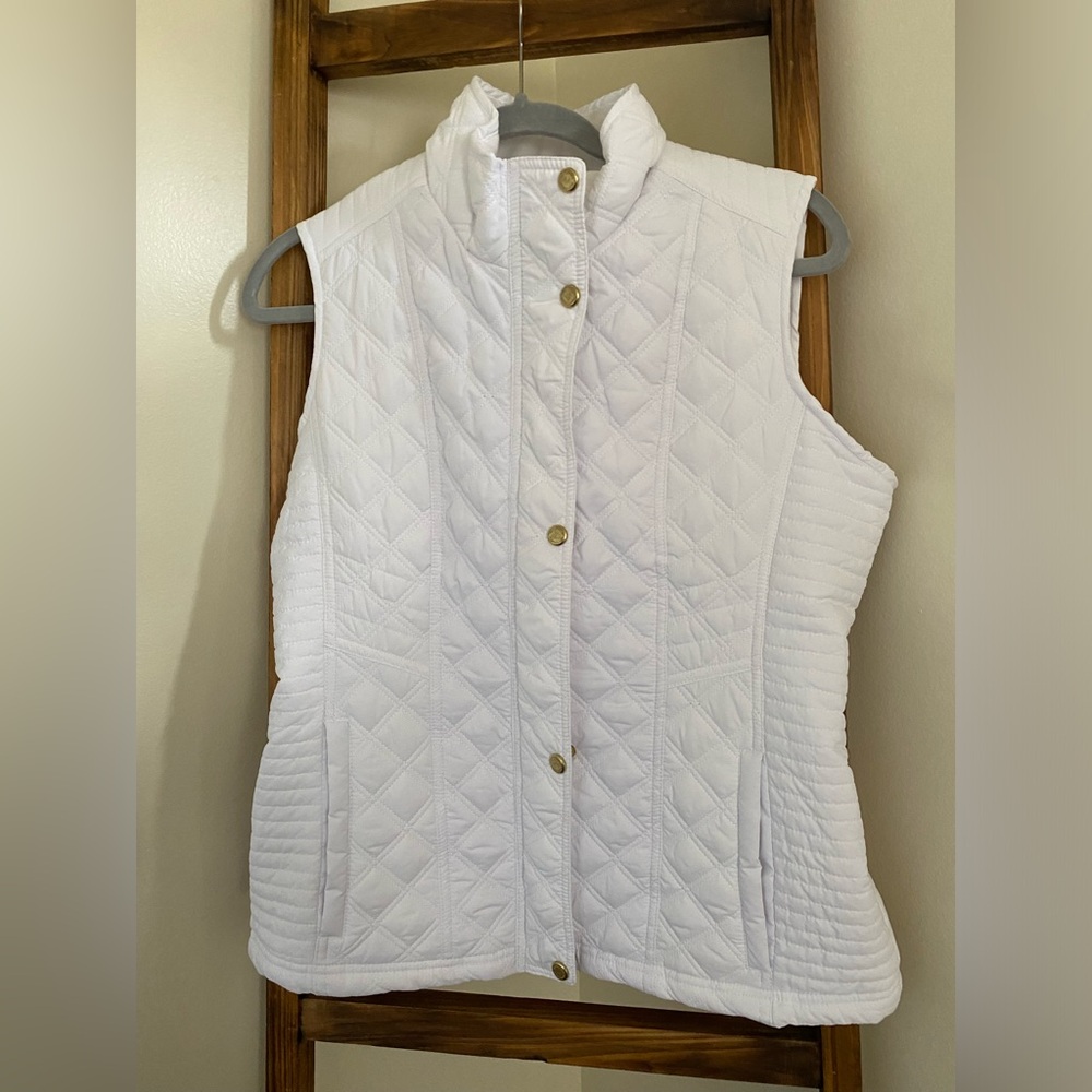 Never worn fleeced line quilted vest.